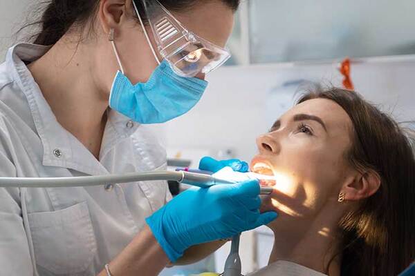 Female dentist working on a woman's teeth