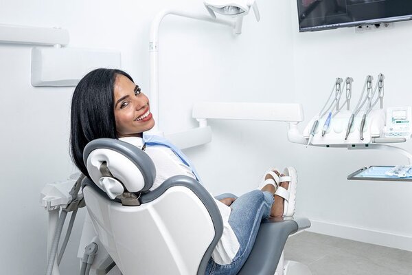 woman sitting in dentist chair